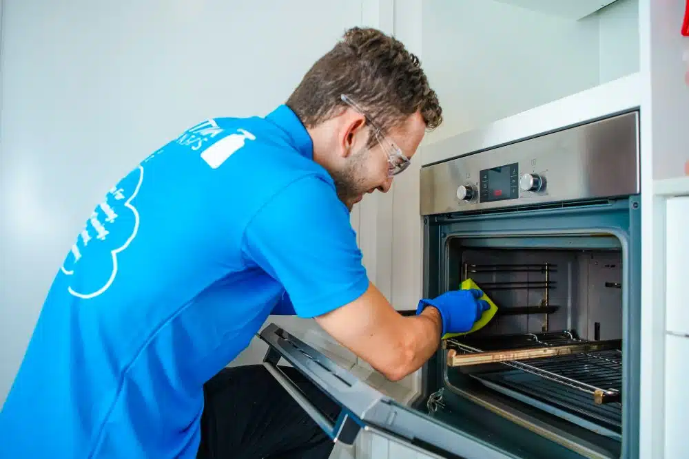 Oven cleaning expert at work