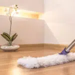 Microfibre flat mop cleaning a timber floor