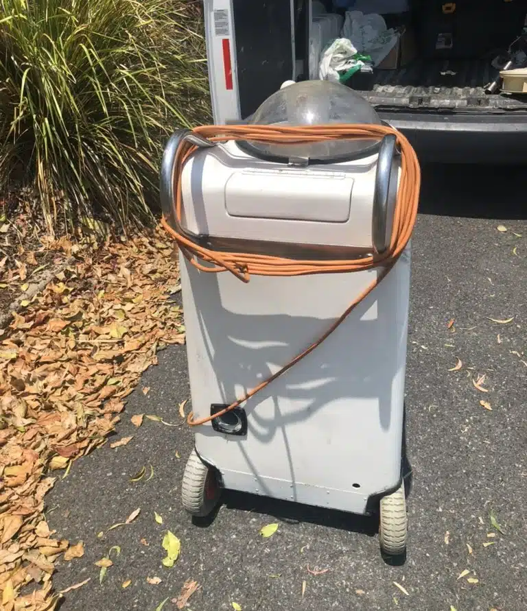 Optima Cleaners portable carpet extraction machine at the van