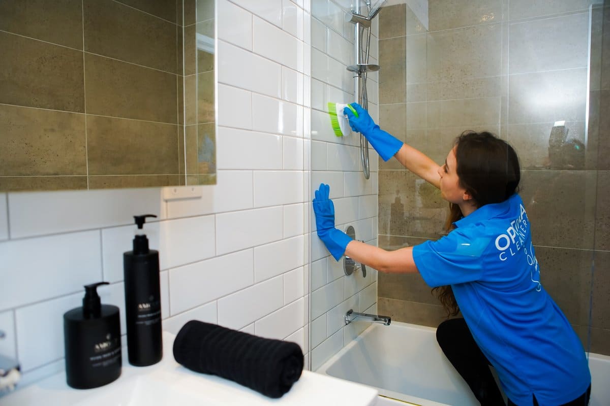 Cleaning shower tiles in a bathroom