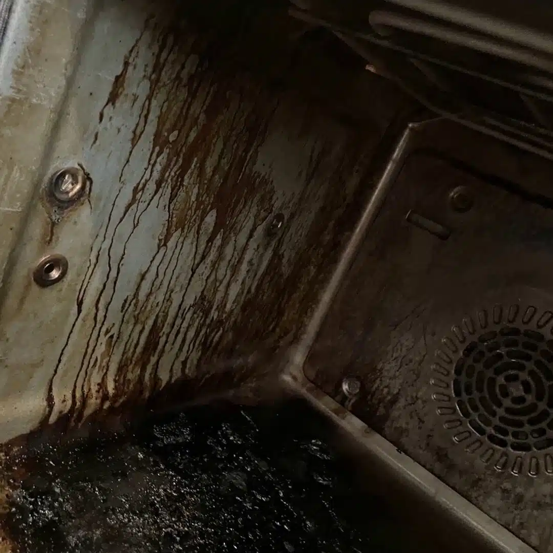 Heavy grease buildup down an oven cavity wall